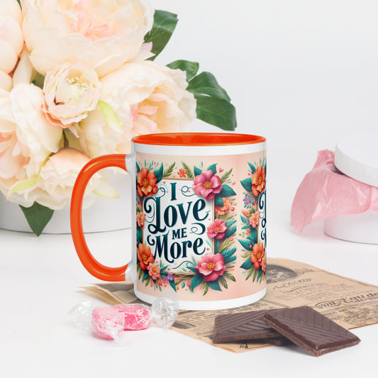 Dark blue I Love Me More affirmation mug with colorful interior, featuring motivational self-love message on the front.