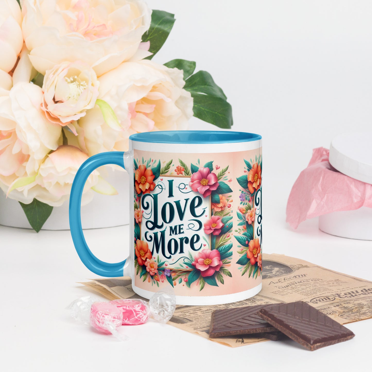 Dark blue I Love Me More affirmation mug with colorful inside, featuring self-love motivational message from I Love Me Vibe.