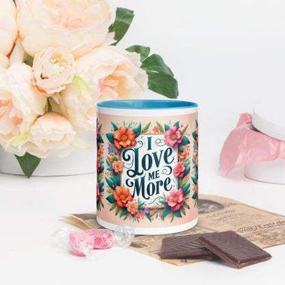 Dark blue I Love Me More affirmation mug with colorful inside, featuring motivational self-love message from I Love Me Vibe.