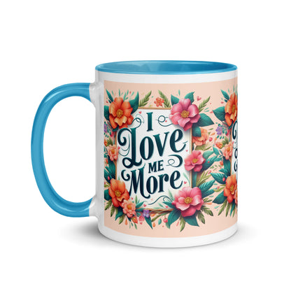 Dark blue I Love Me More affirmation mug with colorful interior, featuring motivational self-love message from I Love Me Vibe.