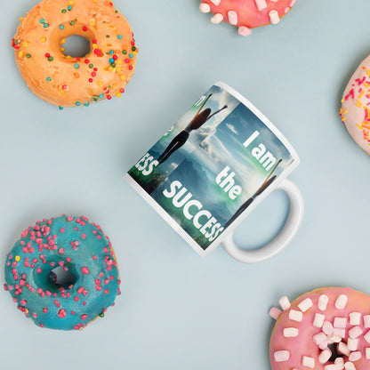White glossy mug with "I Am The Success" affirmation text, empowering daily mindset drinkware from I Love Me Vibe.